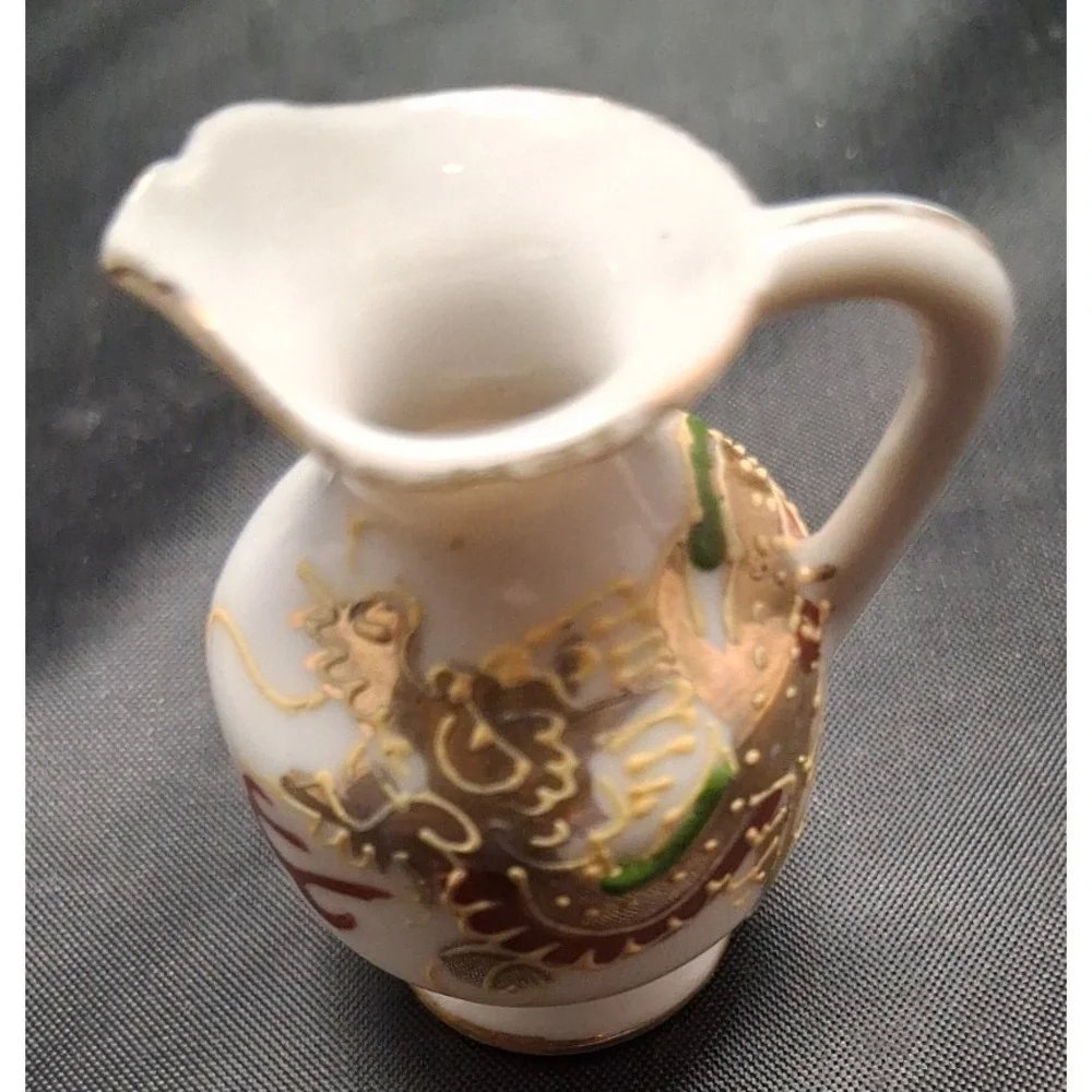 Collection of Seven Vintage Miniature Ceramic Bud Vases with Hand-Painted Design